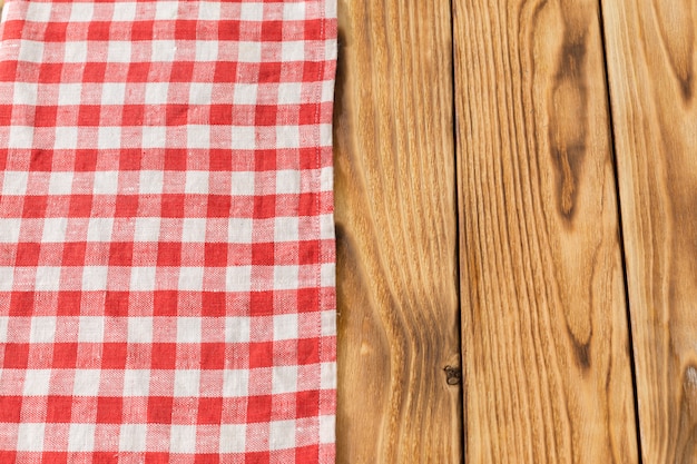 with empty wooden table with tablecloth