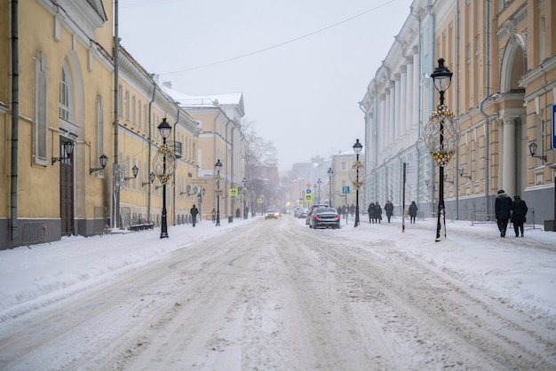 Wnter urban side street. foggy day. deserted side street snowfall in winter city f