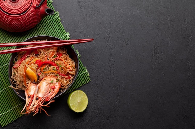 Wok with stir fried noodles shrimps and vegetables