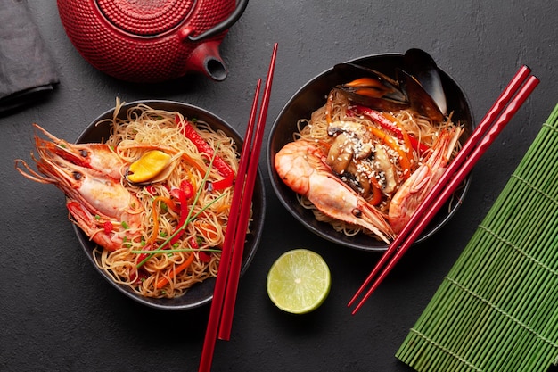 Wok with stir fried noodles shrimps and vegetables