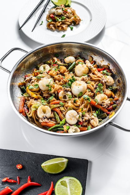 Wok with stir fry Udon noodles, seafood and vegetables. 