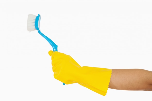 Woman&#039;s hand holding scrubbing brush