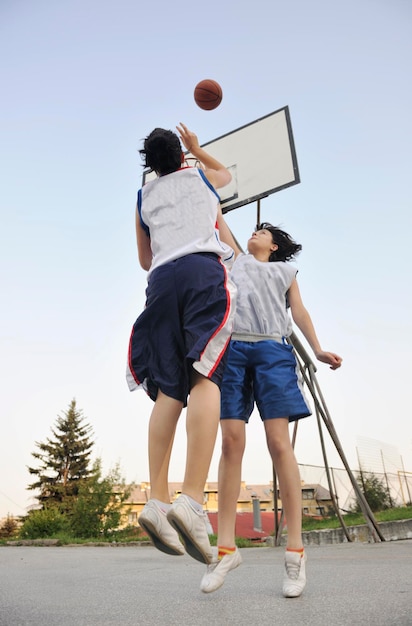 woman basketball player have treining and exercise at basketball court at city on street