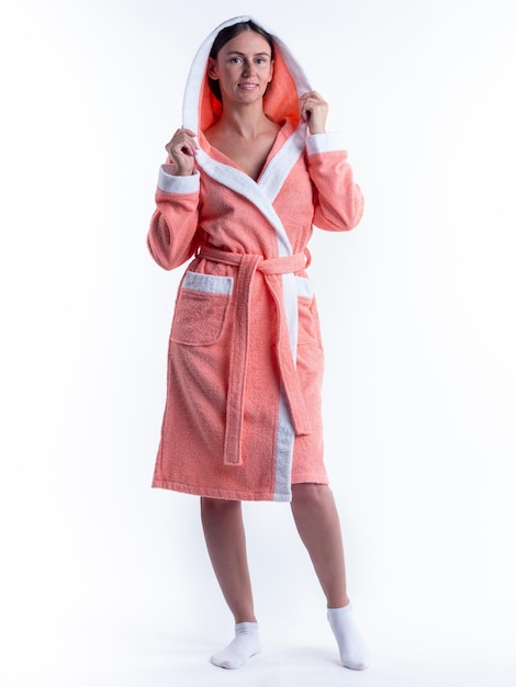 Woman in a Bathrobe on an isolated white background with a smile on her face