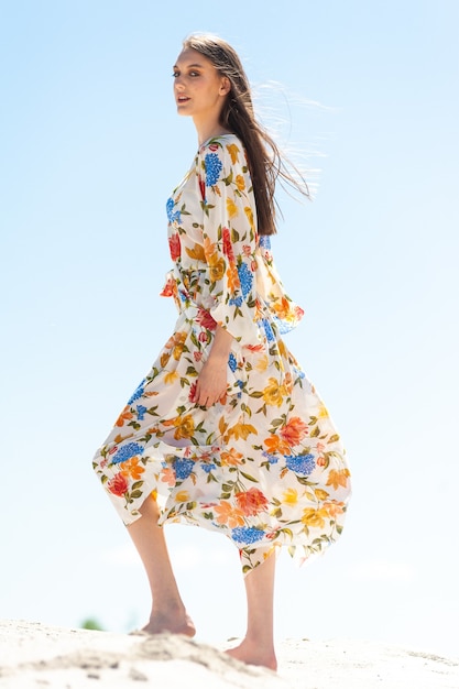 Woman at the beach wearing sarong Tunic and pareo beachwear