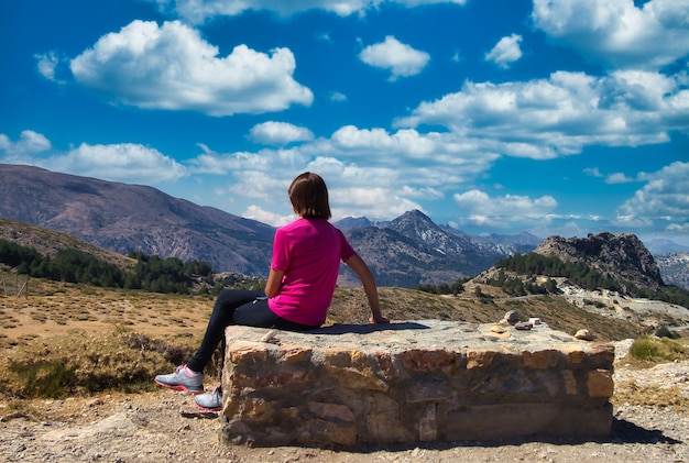 Woman in beautiful mountain landscape.