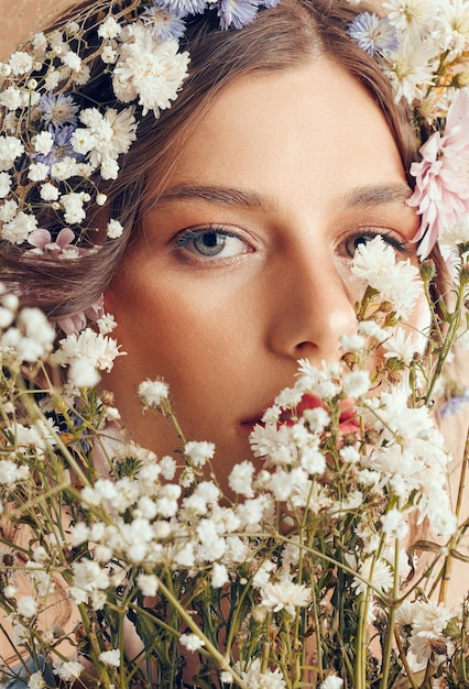 Woman beauty and flower portrait for natural skincare cosmetics makeup and floral head crown Spring flowers organic body care and skin wellness with facial headshor or dermatology glow in studio