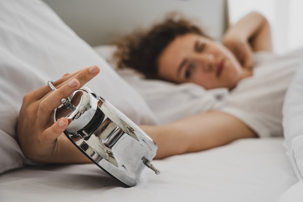 A woman on the bed at morning