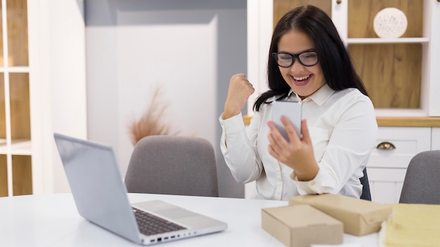 Woman being happy after purchasing a new thing