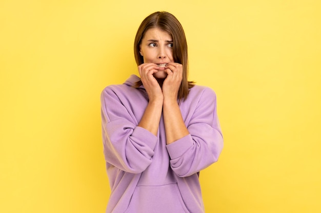 Woman biting nails terrified about problems suffering phobia anxiety disorder