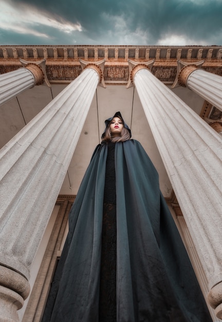 A woman in a black cloak