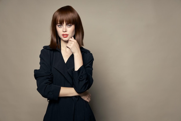 Woman in black coat portrait cropped Beautiful face