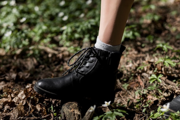 Woman in black leather shoes