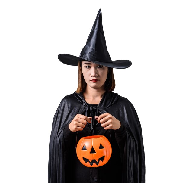 woman in black Scary witch halloween costume standing with hat isolated white 