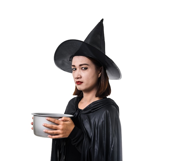 woman in black Scary witch halloween costume standing with hat isolated white 