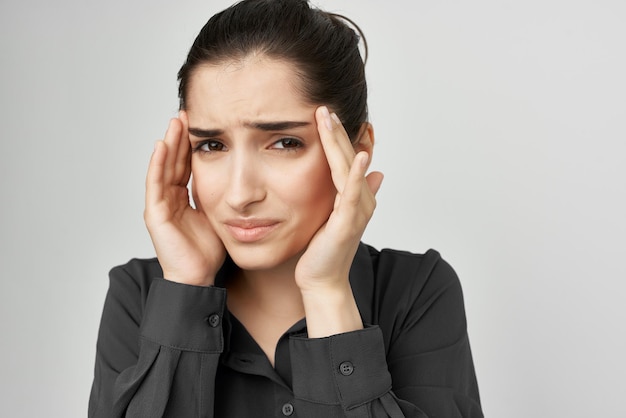 Woman in black shirt headache discontent trouble isolated background