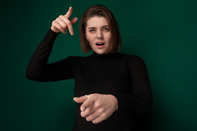 Woman in black shirt pointing