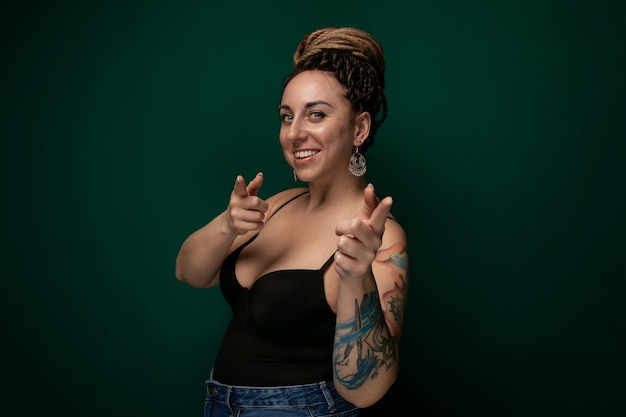 Woman in black tank top making peace sign