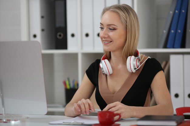 Woman blonde is studying online