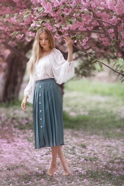 Woman at Blossoming Sakura Tree on Nature