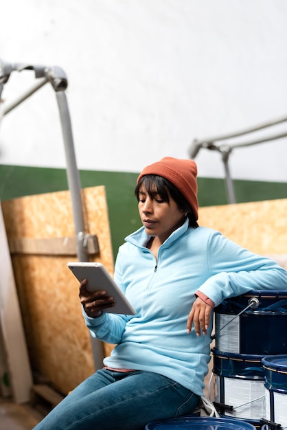 Woman in a blue blouse working in a warehouse