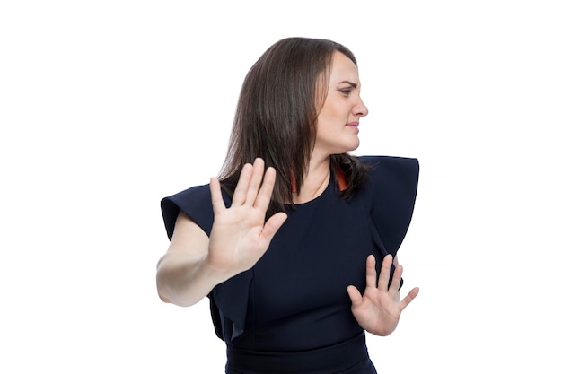 The woman in the blue dress held out her palms in denial Negativity and rejection Isolated on white background Closeup