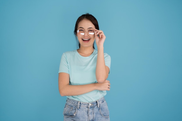 A woman in a blue shirt is smiling in various poses looking at the camera