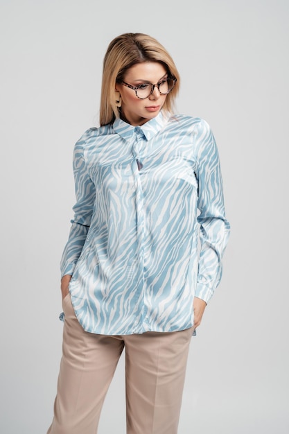 Woman in a blue shirt on a white background