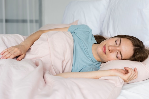 Woman in blue tshirt sleeping