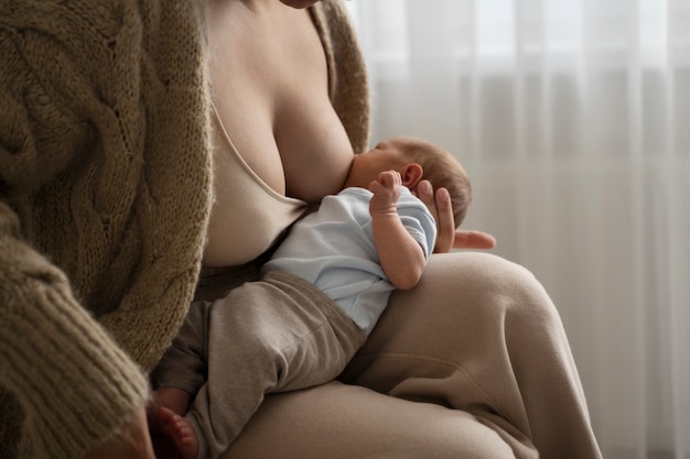 Woman breast feeding her child