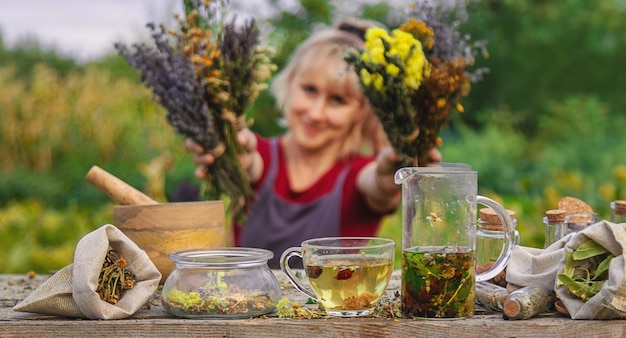 woman brews herbal tea Selective focus