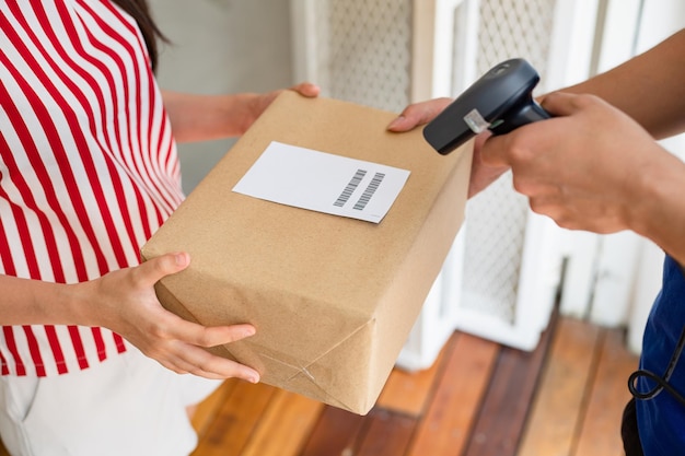 Woman brings parcels to the post office