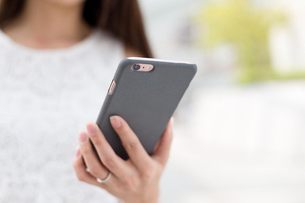 Woman browsing internet on smart phone