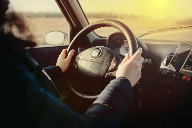 woman car driver hands on steering wheel