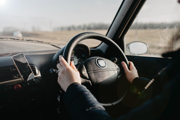 woman car driver hands on steering wheel