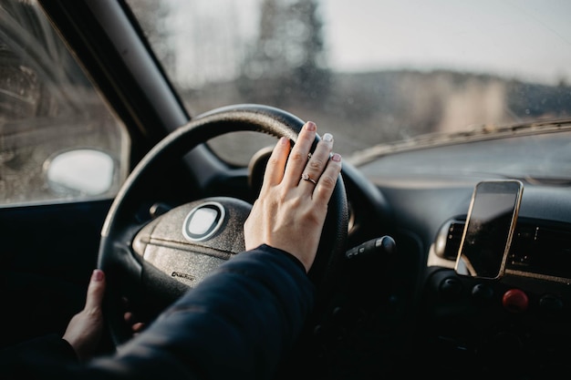 woman car driver hands on steering wheel