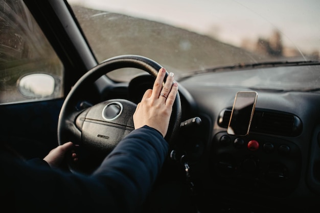 woman car driver hands on steering wheel