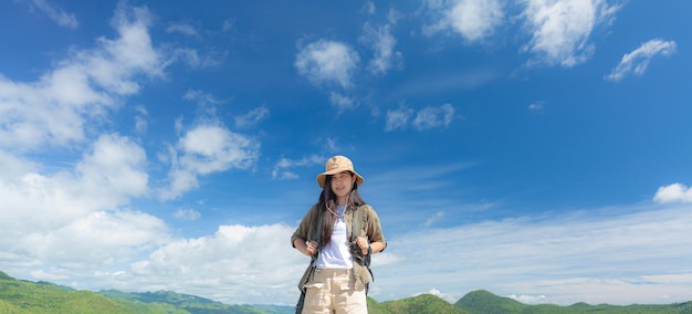 woman carrying a backpack to travel nature and mountains,silhouette of a woman carrying a backpack