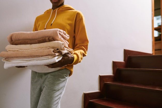 Woman Carrying Fluffy Towels