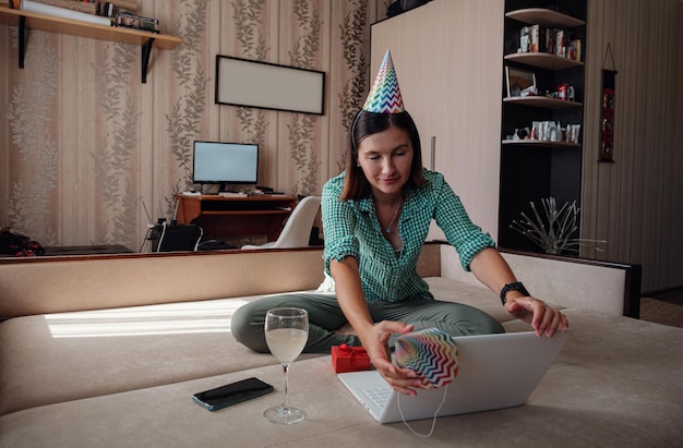 Woman celebrating birthday online in quarantine time