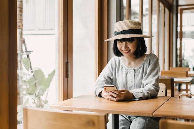 Woman chatting with friends on her smartphone