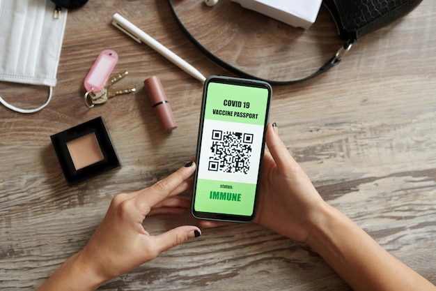 Woman Checking Vaccine Passport on Smartphone