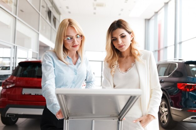 Woman chooses a new car