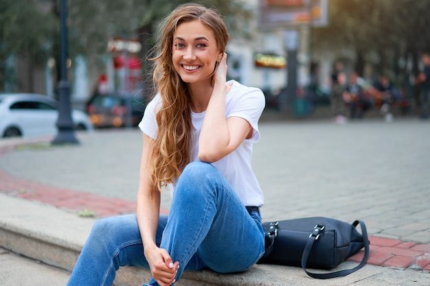 Woman city street summer sitting stairs