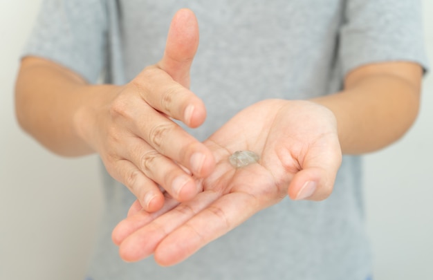 Woman clean hand with alcohol gel