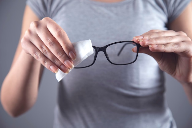 Woman cleaning glasses