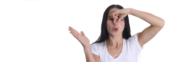 Woman closes nose from bad smelly smell smell and smell in humans concept