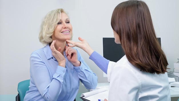 Woman comes for consultation with beautician for facelift