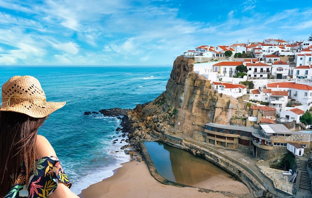 Woman contemplating the view of Azenhas do Mar region of Lisbon Sintra Portugal Travel concept