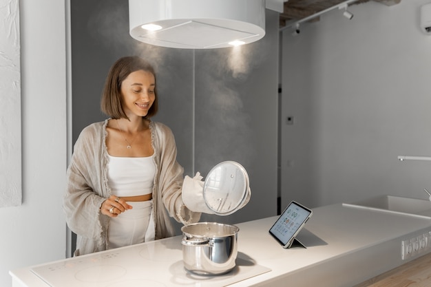 Woman cooking at modern kitchen